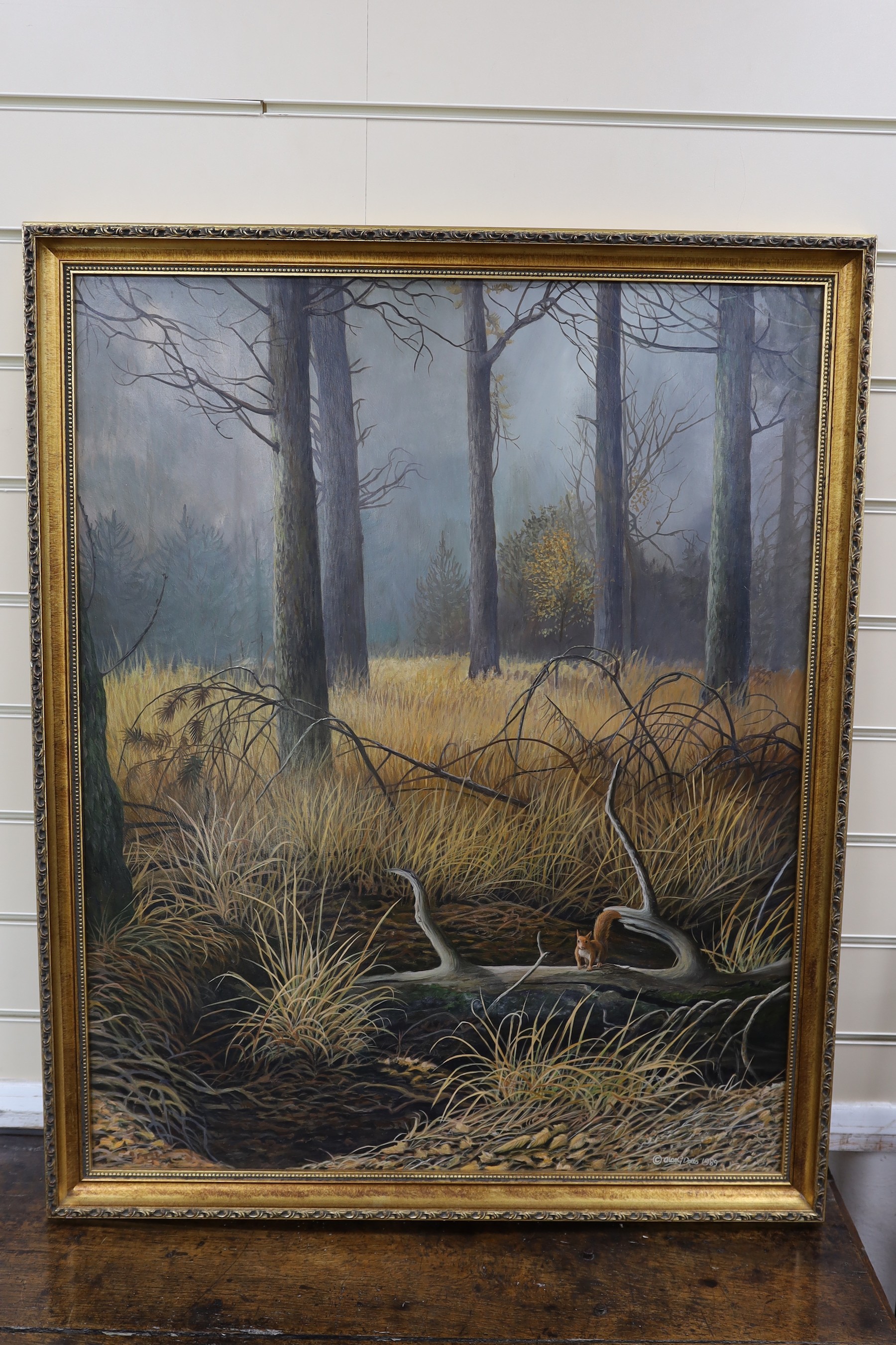 Alan G Dobbs, oil on board, squirrel in a wooded landscape, signed and dated 1989 76x60cm